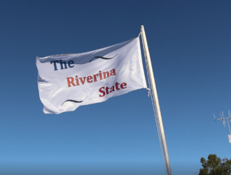 Raising The Riverina State Group Flag.